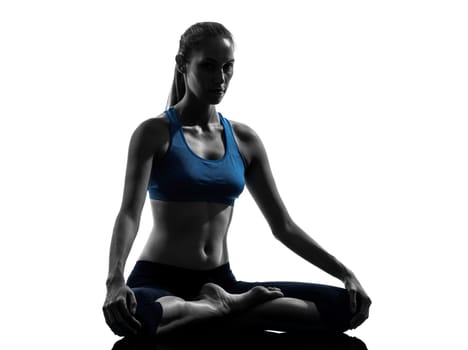 one caucasian woman exercising yoga meditating in silhouette studio isolated on white background