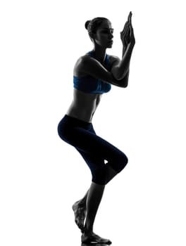 one caucasian woman exercising yoga yoga camel pose in silhouette studio isolated on white background