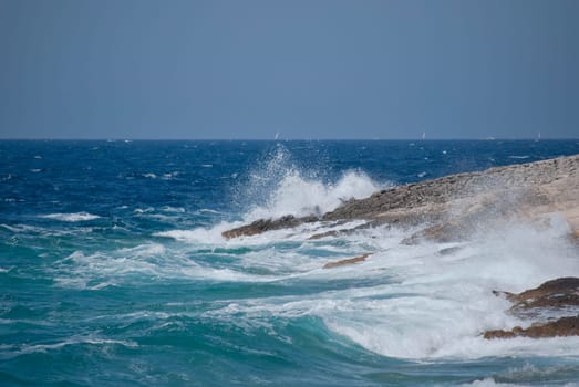 waves breaking on the shore