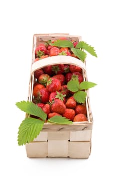 Fresh juicy strawberries in wooden basket isolated on white