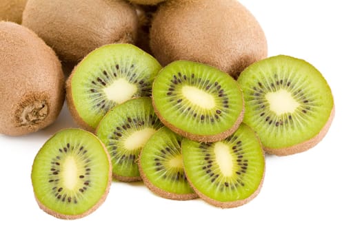 A few green fresh kiwi fruits, slices