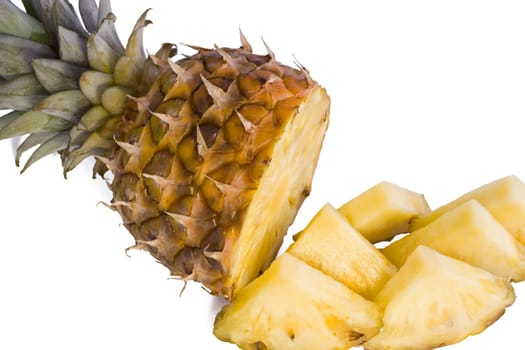 Ripe fruits pineapple with slices isolated on white