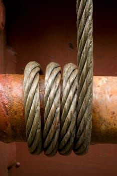 Steel cable wrapped around a tensioner