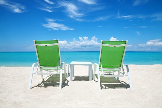 Two deckchairs on a beautiful beach