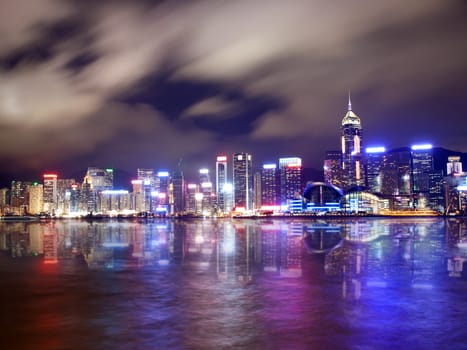 Hong Kong skyscrapers reflected on water at night