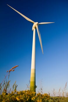 Windmills against a blue sky, alternative energy source
