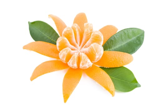 Peeled fresh juicy tangerine with green leafs
