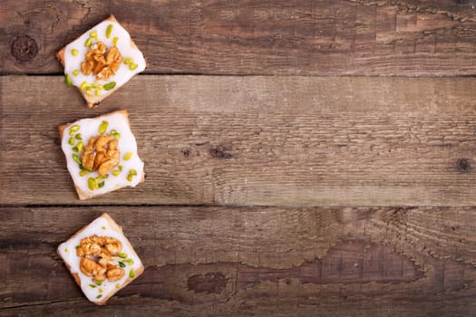 3 Christmas cookies on wooden board