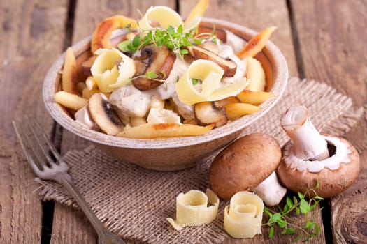 golden brown potato noodles with fresh champions
