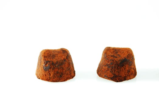 two pralines on white