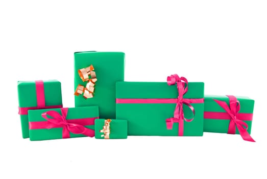 many gifts in gaudy coloures in a row, on white