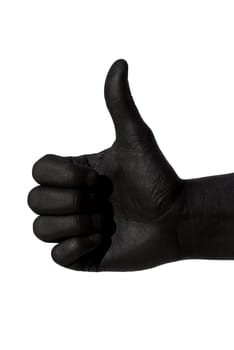 a black painted hand is doing a thumbs up gesture, on white