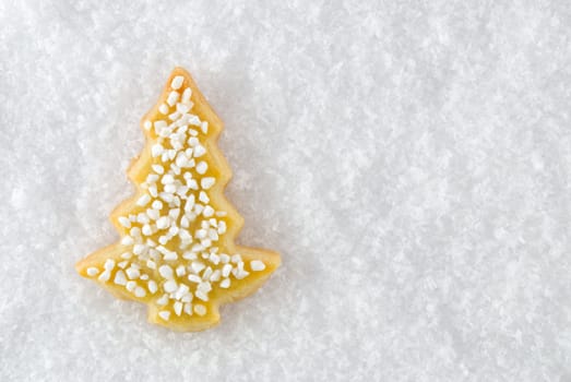 a christmas tree cookie as christmas decoration or as card motif, lying in the