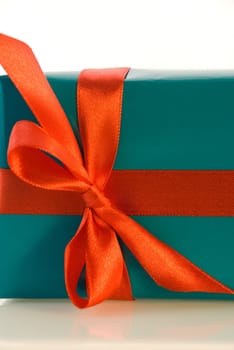 cutout of a blue gift with red bow