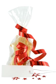 christmas cookies in a bag as a gift, with a label with copyspace in front of it