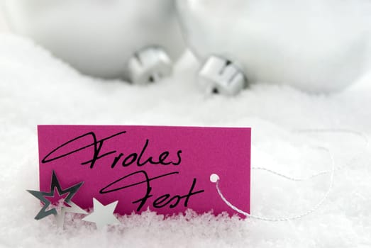 handwritten Frohes Fest on a purple label as christmas background