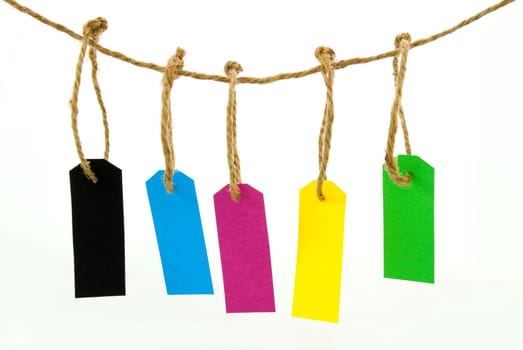some hanging marker tags in different colors, on white