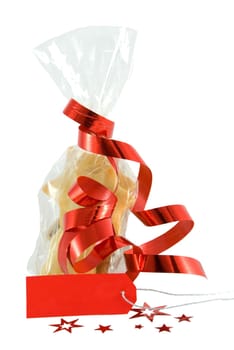 home-baked cookies in a bag as christmas present, with a label with copyspace