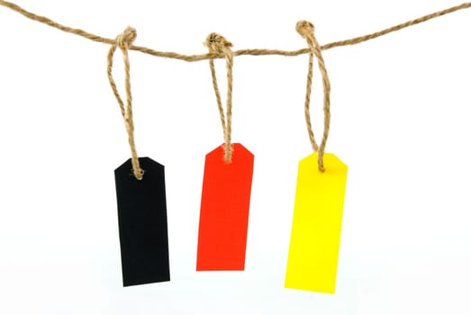 three hanging labels in different colours, isolated