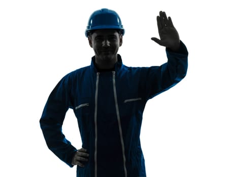 one caucasian man construction worker saluting smiling silhouette portrait in studio on white background