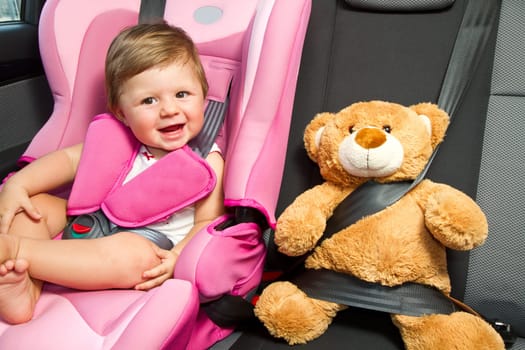 baby in a safety car seat. Safety and security