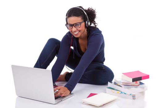Young African student girl using a computer, isolated on white background