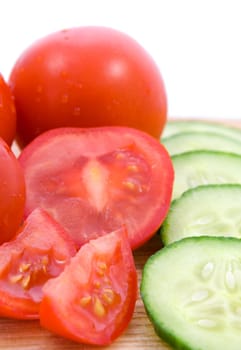 cucumbers and tomatoes in slices and quaters, fresh vegetables