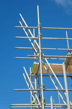 scaffolding construction in building industry with  blue sky