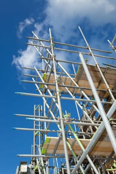 scaffolding construction in building industry with  blue sky