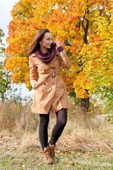 Young woman in autumnal park