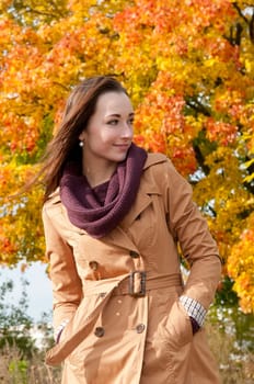 Young woman in autumnal park