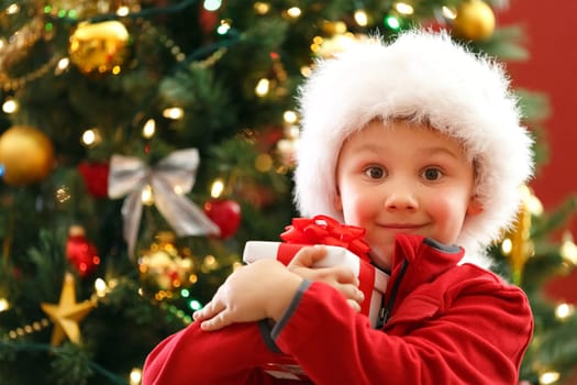 young boy with Christmas gift