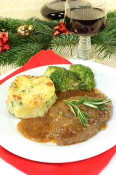 Venison steak with broccoli and potato gratin