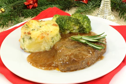Venison steak with broccoli and potato gratin