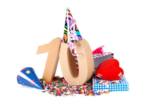 Number of age in a colorful studio setting with paper party hats, a red heart and gifts on a bottom of confettie