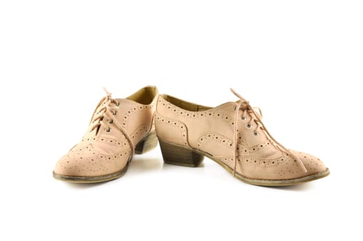 Pair of woman shoes on white background