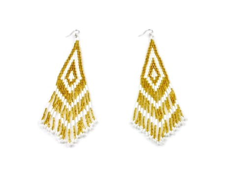 Pair of earrings on white background