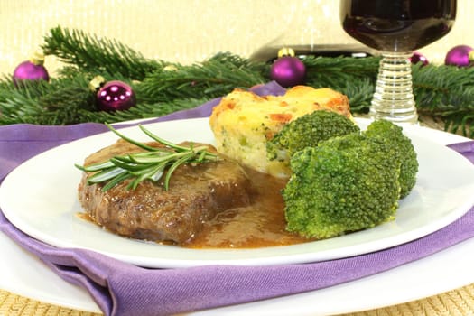 Venison steak with broccoli and potato gratin