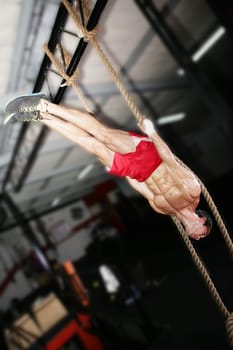 Crossfit athlete on a dark background.