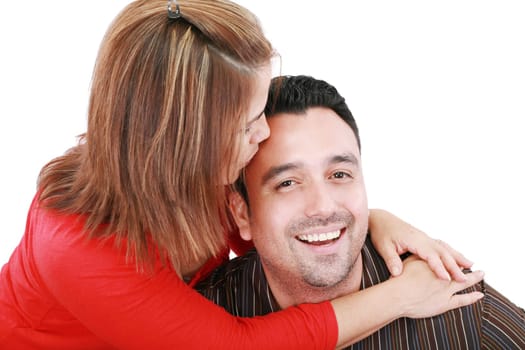 Beautiful woman kisses her husband, isolated on white