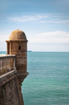 Old castle near sea, blue sky and sea