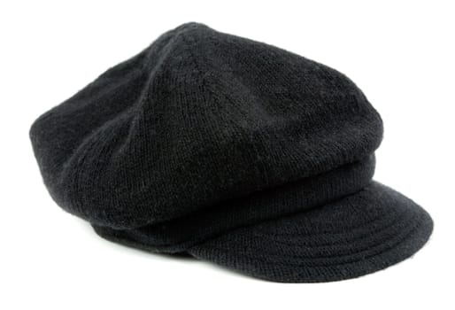 Warm black women's cap in the studio on a white background
