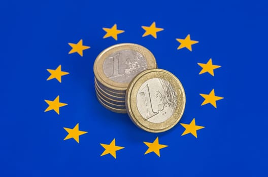 Euro coins on the EU flag