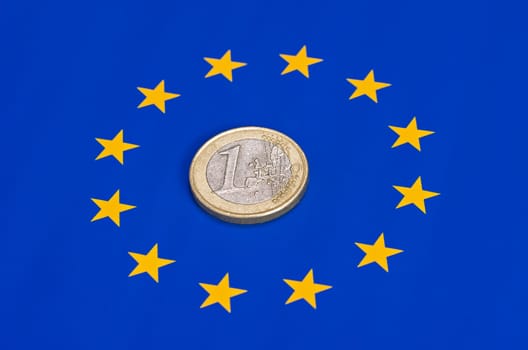 Euro coin on the EU flag