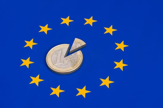 Euro coin divided on the EU flag