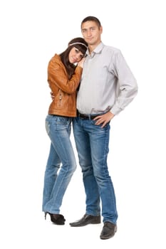 Full length of attractive Caucasian couple standing together on white background