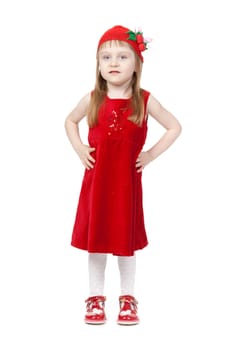 Portrait of a young girl in full growth in a red dress