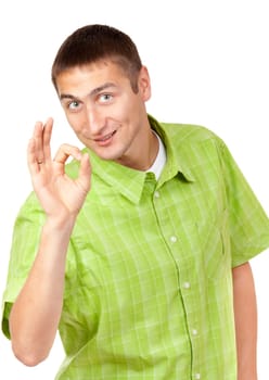 A nice young man wearing green checkered shirt shows Ok symbol. Isolated on white background.