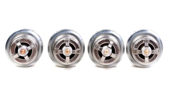 Four spark plugs the car close-up view from the electrodes
