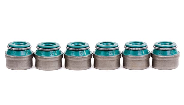 six valve stem seals on a white background